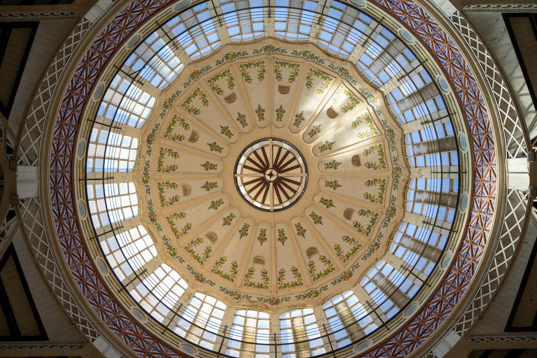 Intricate Art Nouveau dome ceiling of Mercat Central in Valencia, Spain, beautifully ornamented and historic.